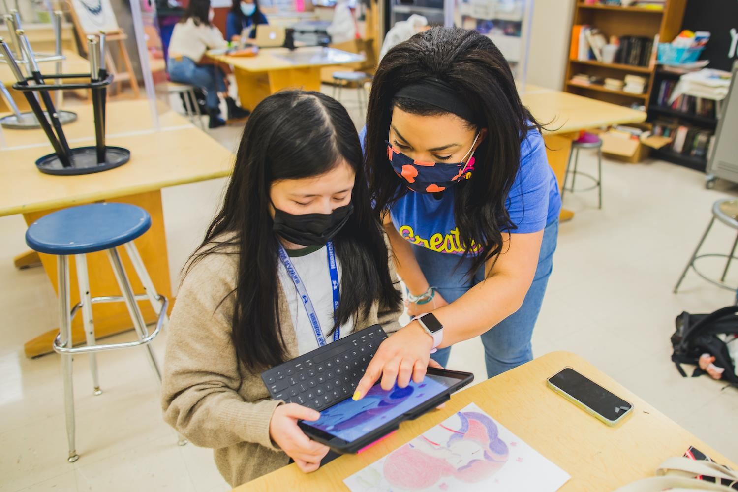 Teacher Helping Student